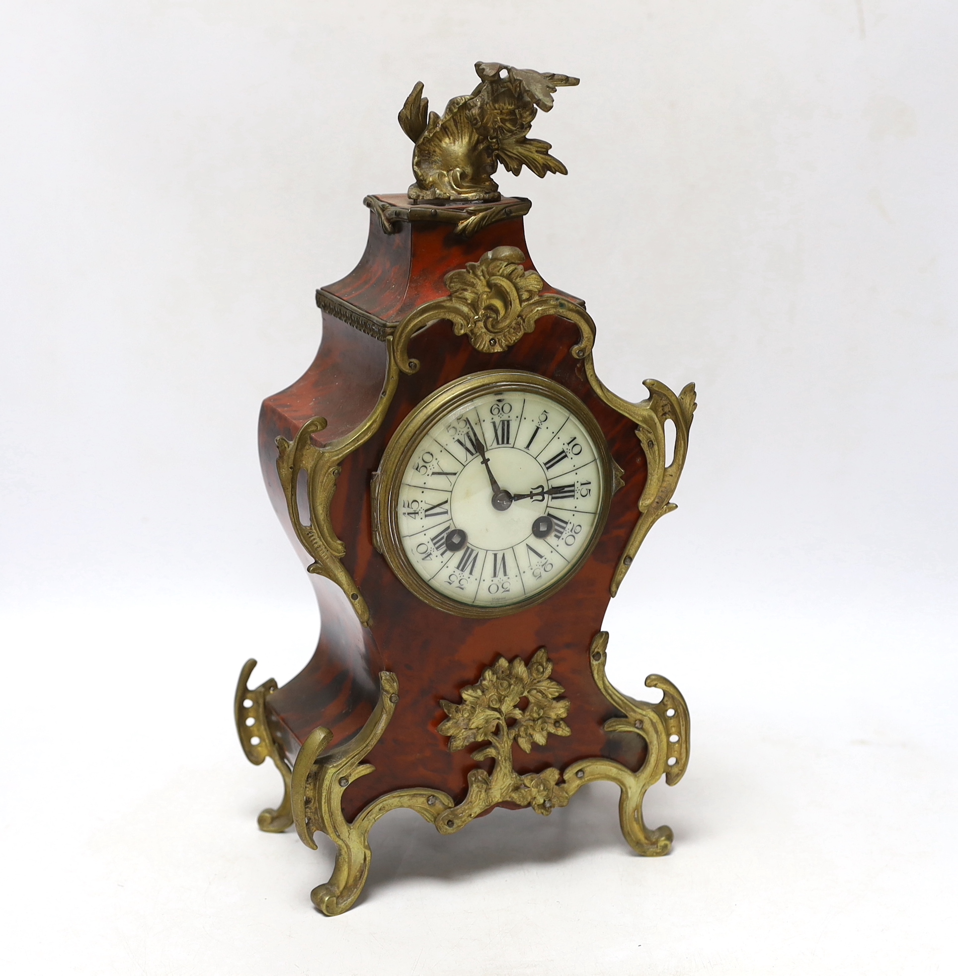 A late 19th century Louis XV style eight day red tortoiseshell and gilt metal cased mantel clock, 34cm high